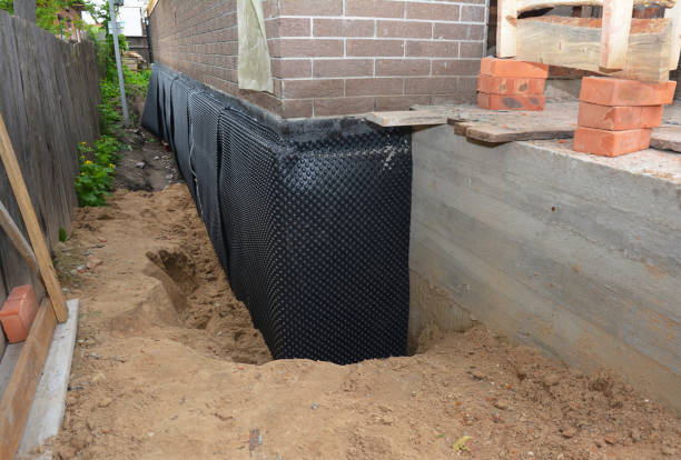 SJ Waterproofing Pros technician performing targeted Waterproofing assessment in Cohoctah, MI